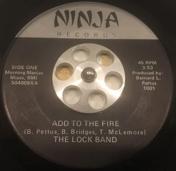 Secure Checkout The Lock Band - Add To The Fire / You've Got Me In A Trance (1985)